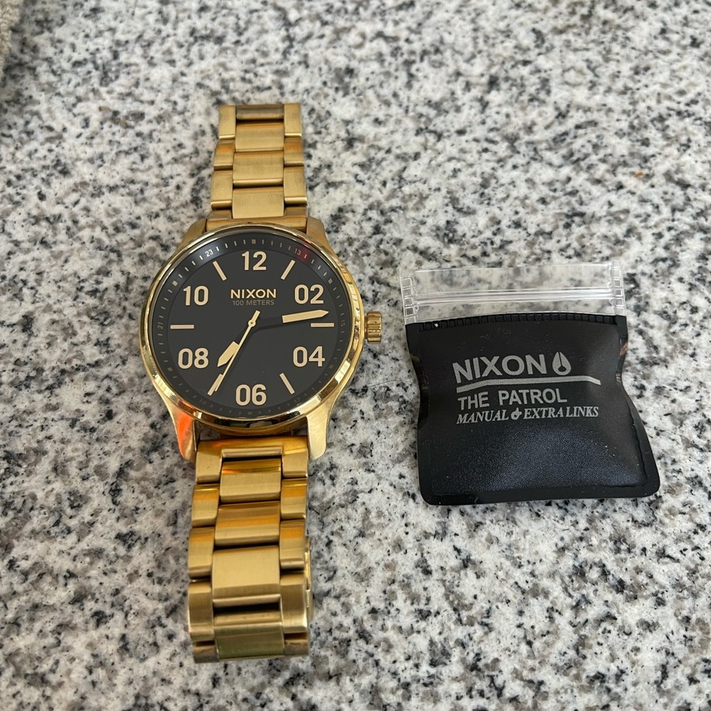 gold nixon watch
